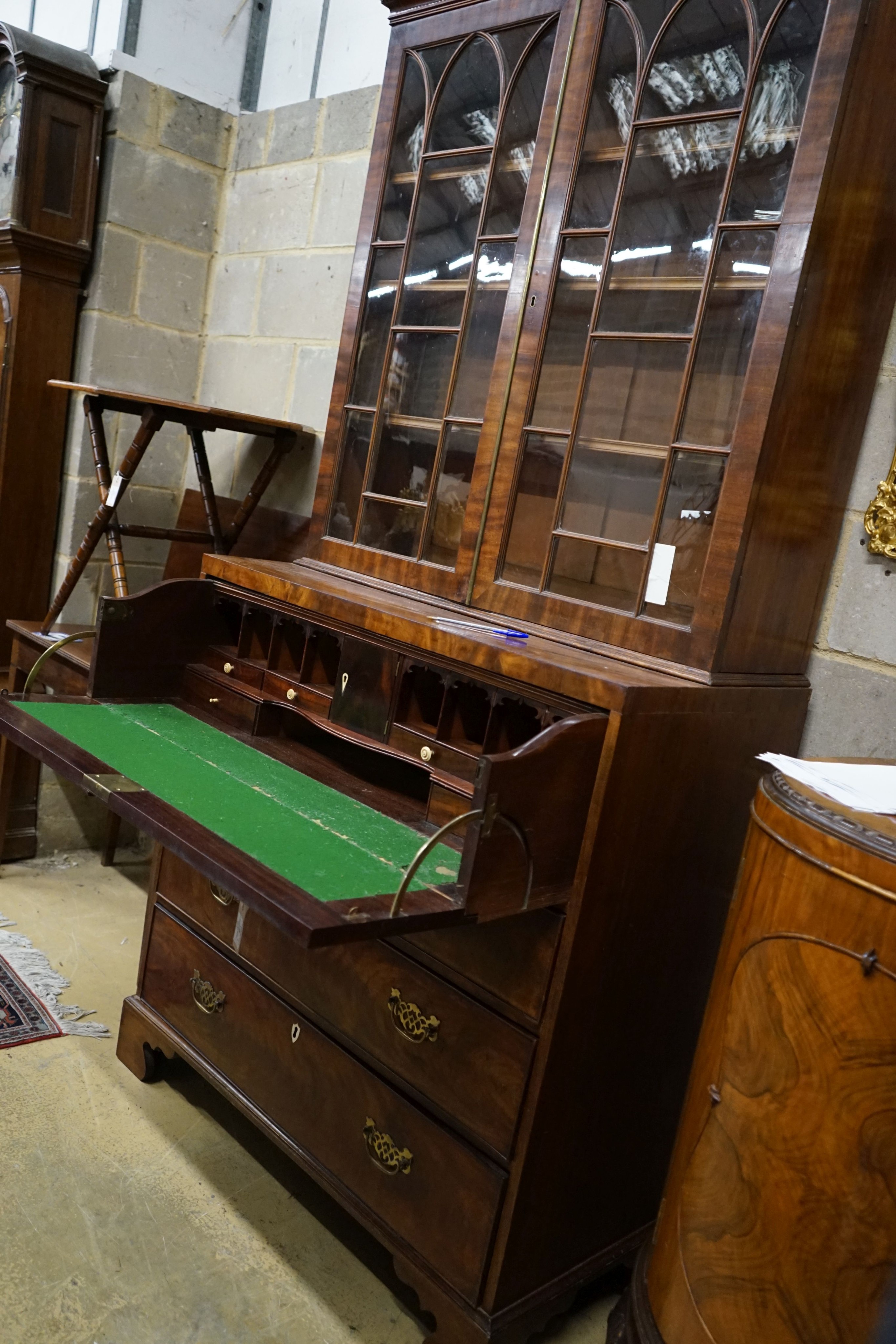 An early 19th century inlaid mahogany secretaire bookcase, length 103cm, depth 53cm, height 221cm